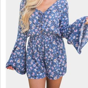 Blue floral romper never worn